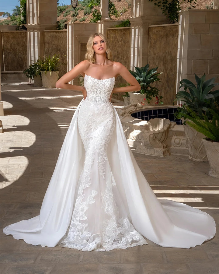 White strapless lace bridal gown with corset-style bodice and flowing full skirt