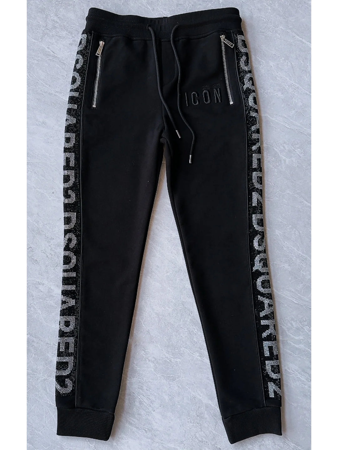 Black DSQUARED2 joggers with drawstring waist and vertical logo tape along the sides