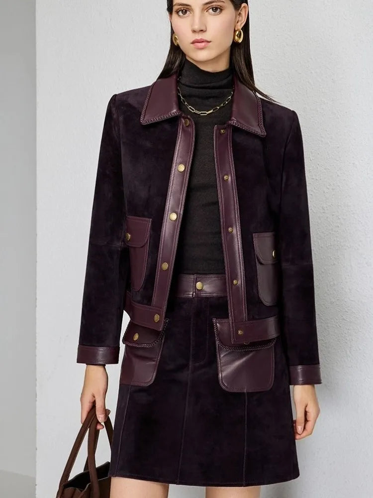 Dark purple suede lapel jacket with snap placket, patch pockets, and buttoned belt tabs.