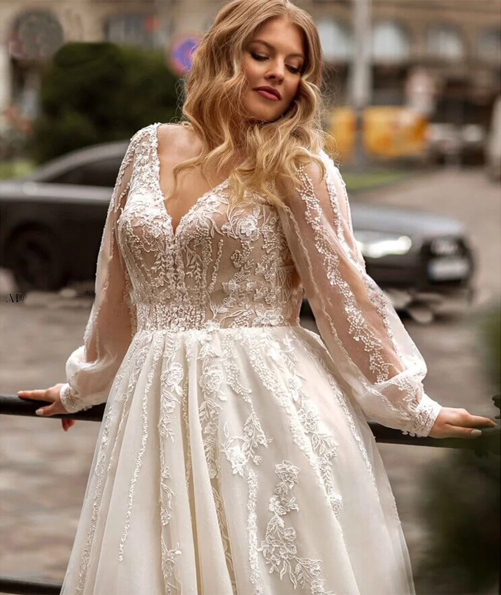 Plus size bridal gown in sheer long sleeves with lace bodice and tulle skirt, ivory