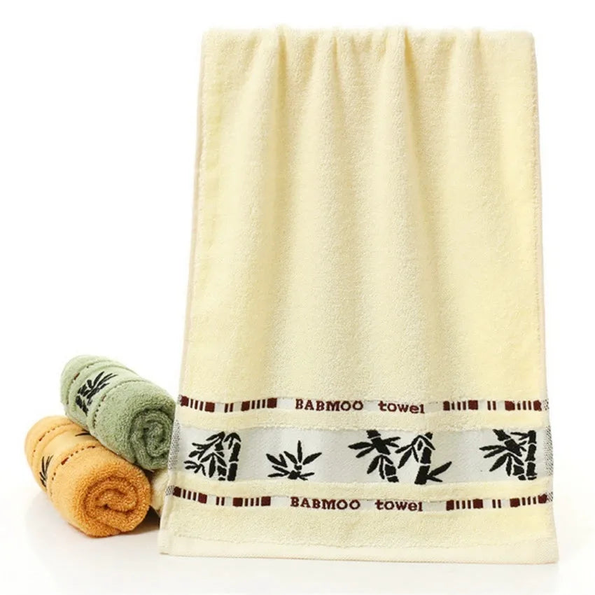Bamboo bath towel set: cream towel with printed band and rolled towels
