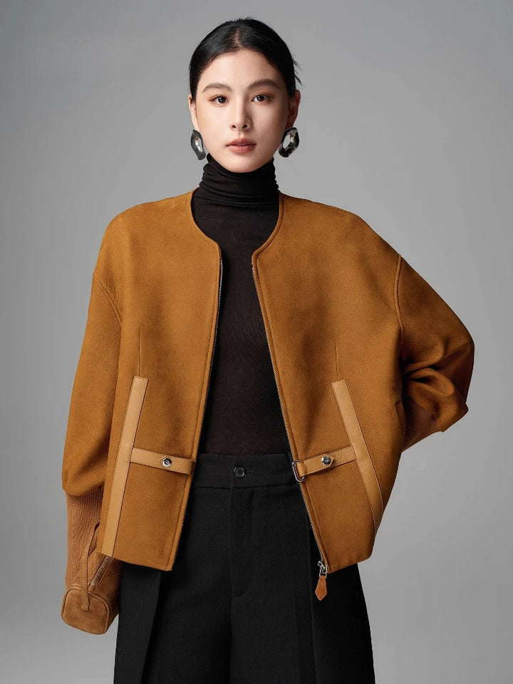 Mustard-brown cropped shearling leather jacket with zip, flap pockets, snap straps