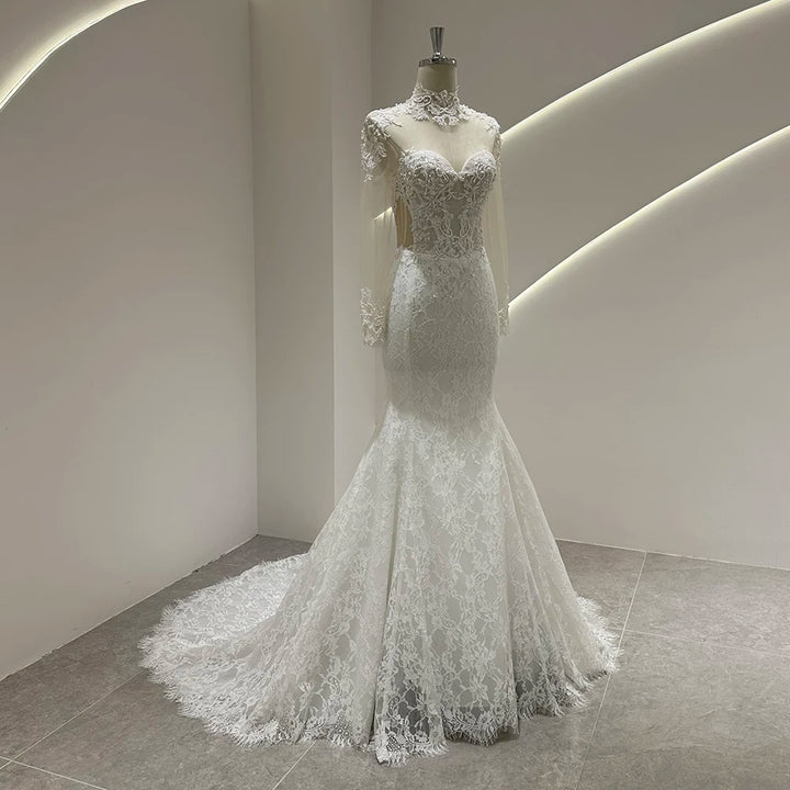 Ivory lace mermaid wedding gown with lace bodice and flared hem, long train