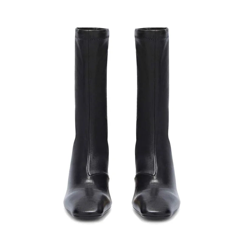 Pair of black square-toe ankle boots with mid block heel, back view