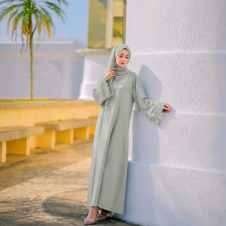 Sage green modest abaya dress with matching headscarf, lace-trim sleeves
