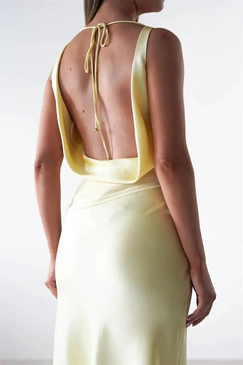 Light yellow satin evening maxi dress, open back with tied neck strings