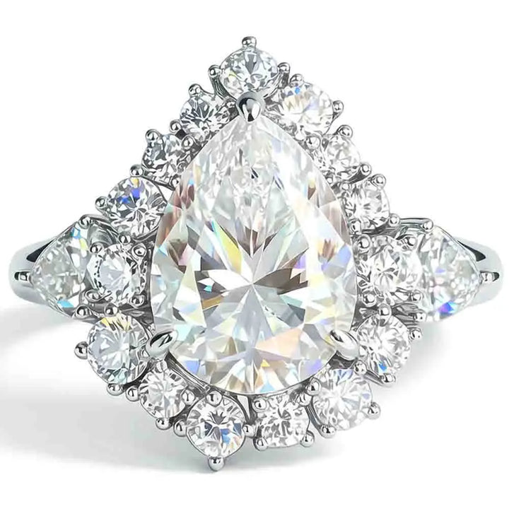 Pear-cut diamond ring with teardrop center stone and round halo gemstones