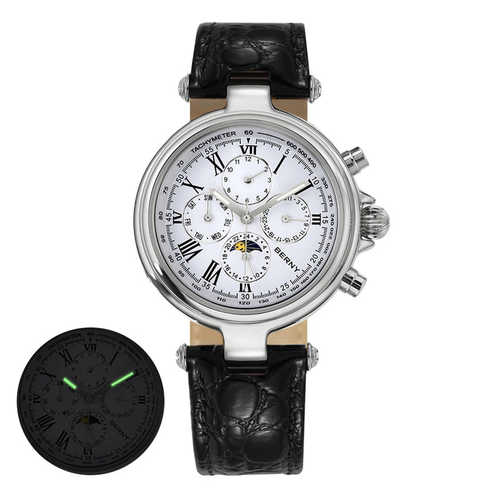 Luxury watch with black leather strap and additional watch face, packaging, and accessories on a white background.