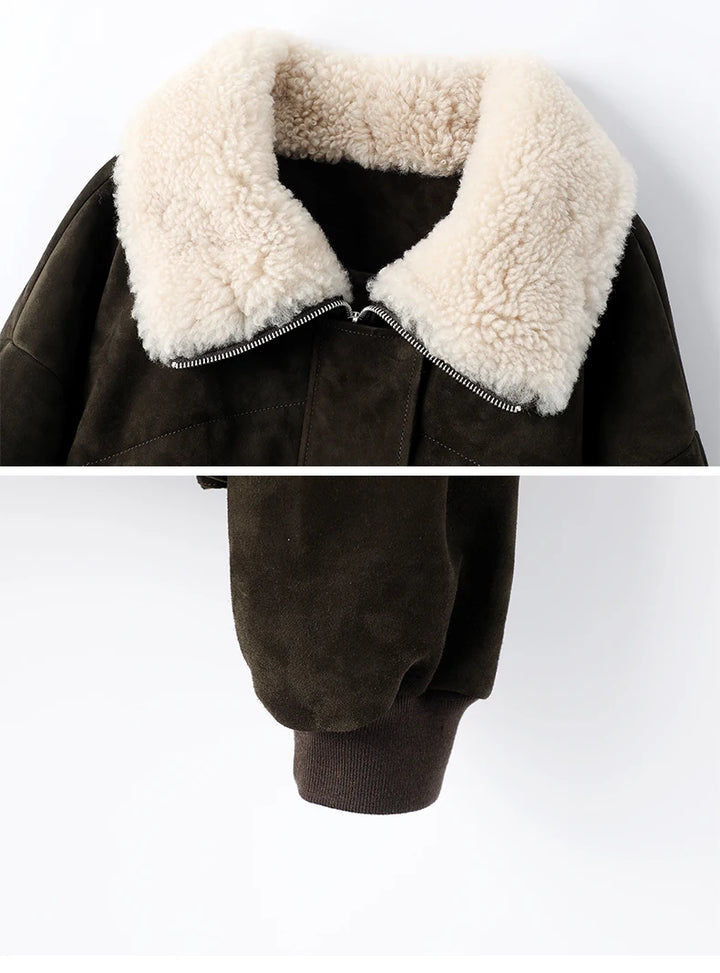 Cream sherpa-trimmed collar on dark olive suede coat with black zip
