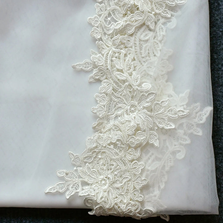 White embroidered lace veil with floral lace trim