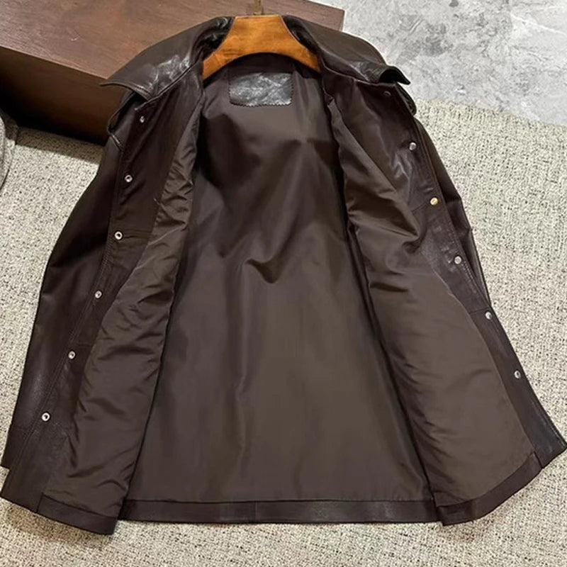 Buttoned dark leather coat with point collar and flared sleeves