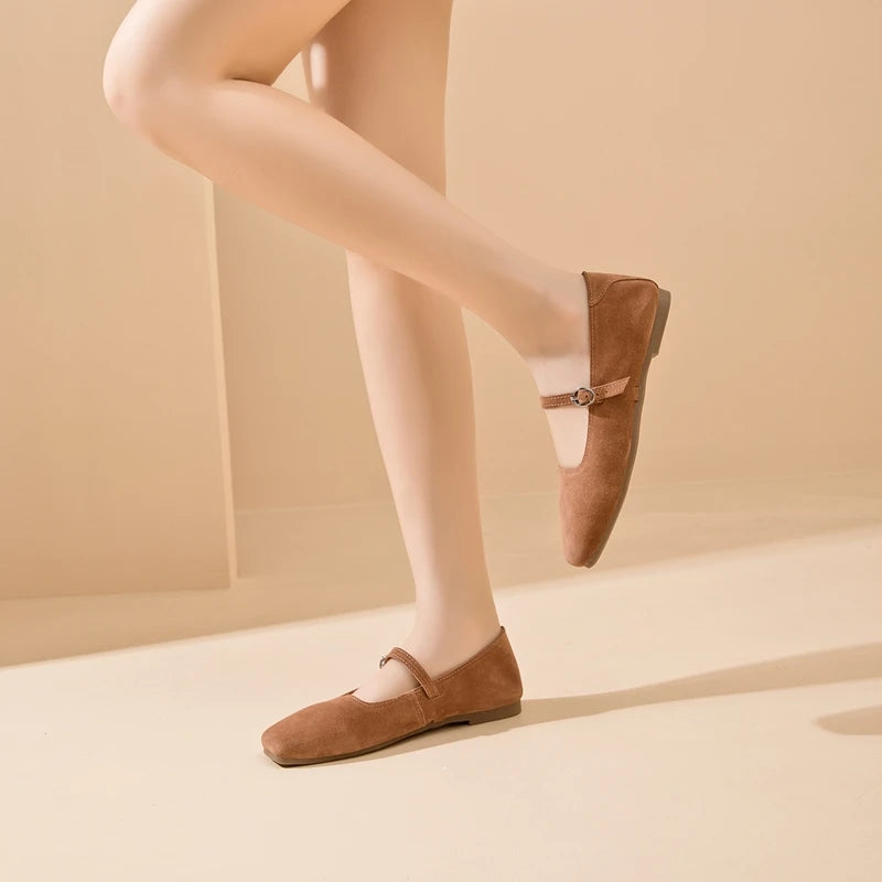Brown suede flat shoes with side buckle strap and rounded toe