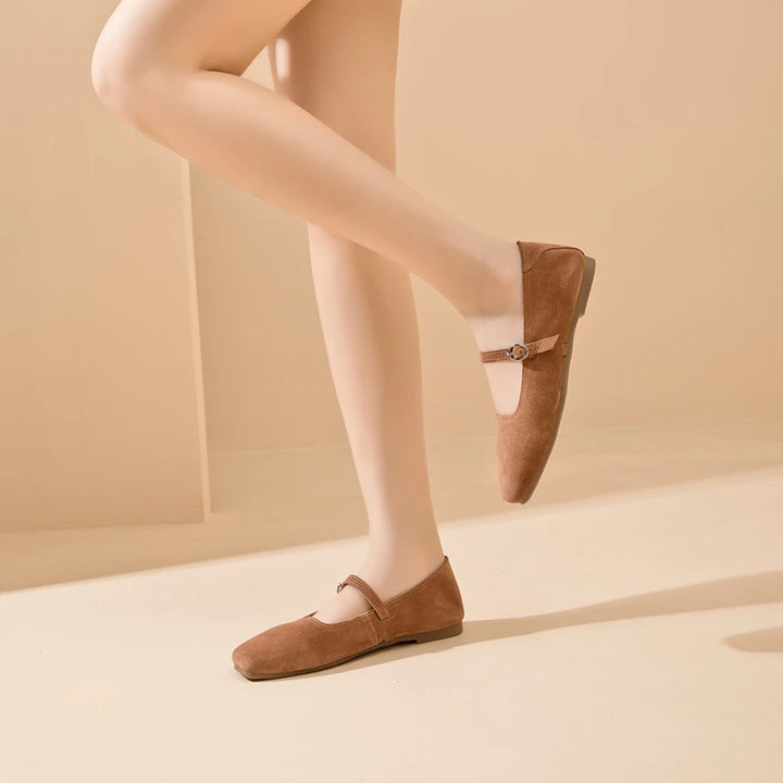 Brown suede flat shoes with side buckle strap and rounded toe