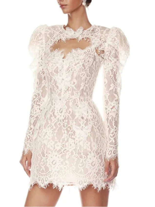 White lace dress worn by a model on a white background