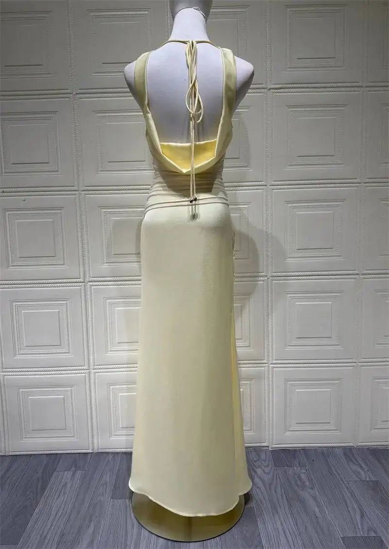 Light yellow satin evening maxi dress, open back with tied halter straps
