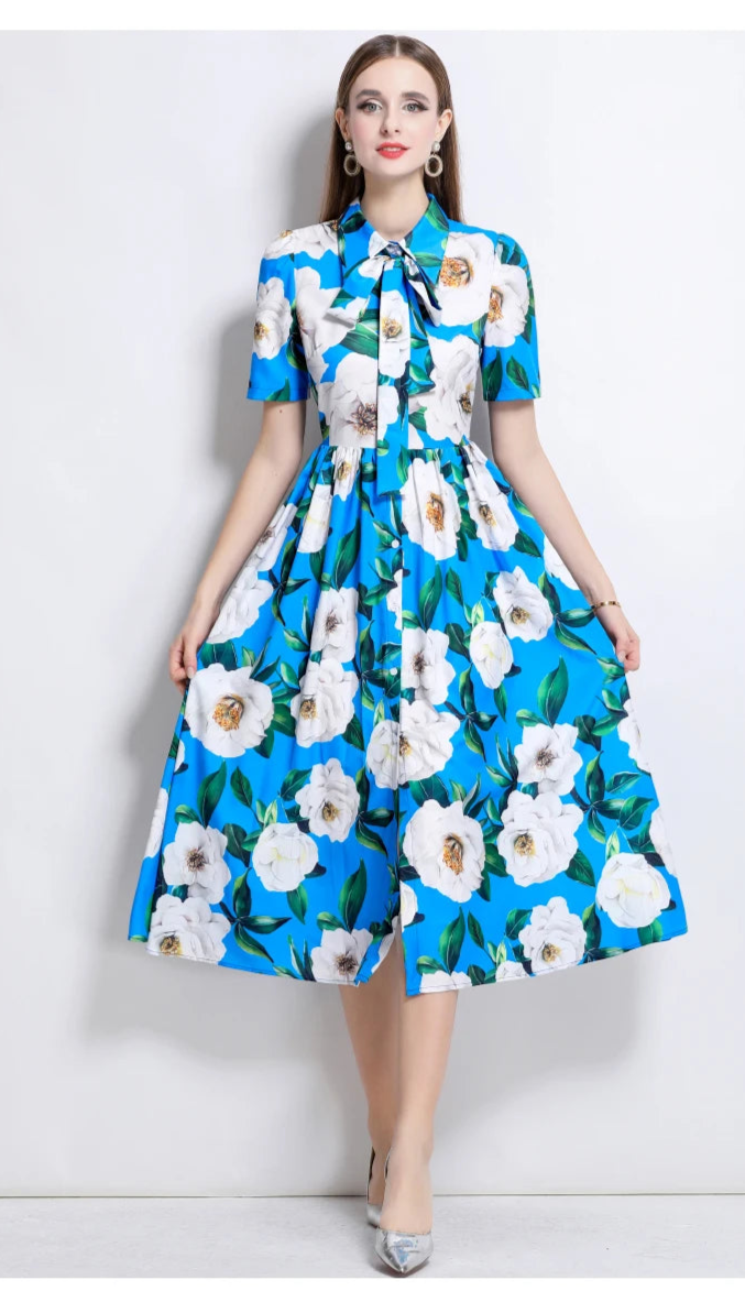 Woman wearing a blue floral dress on a white background