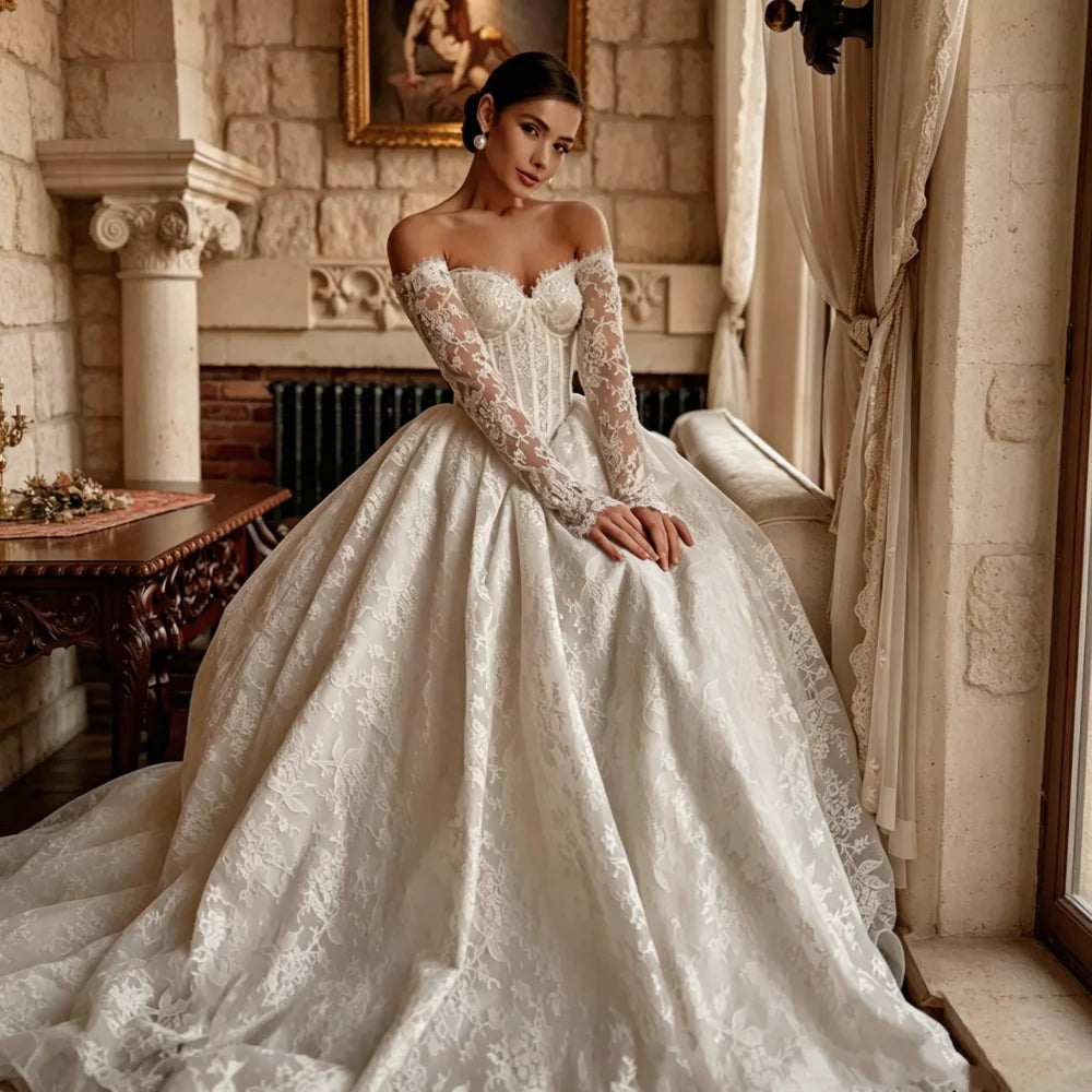 Lace A-line wedding gown with off-shoulder sweetheart neckline and long sleeves