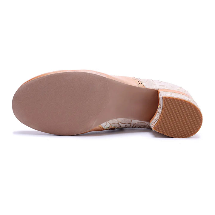 Outsole view of light khaki low-heel shoes with tan rubber sole, side profile.
