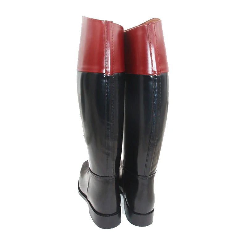 Back view of knee-high riding boots, red upper and black lower glossy leather.
