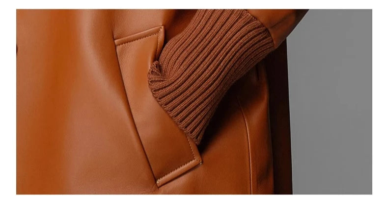 Women’s sheepskin woven coat pocket flap and rib-knit cuff detail in orange
