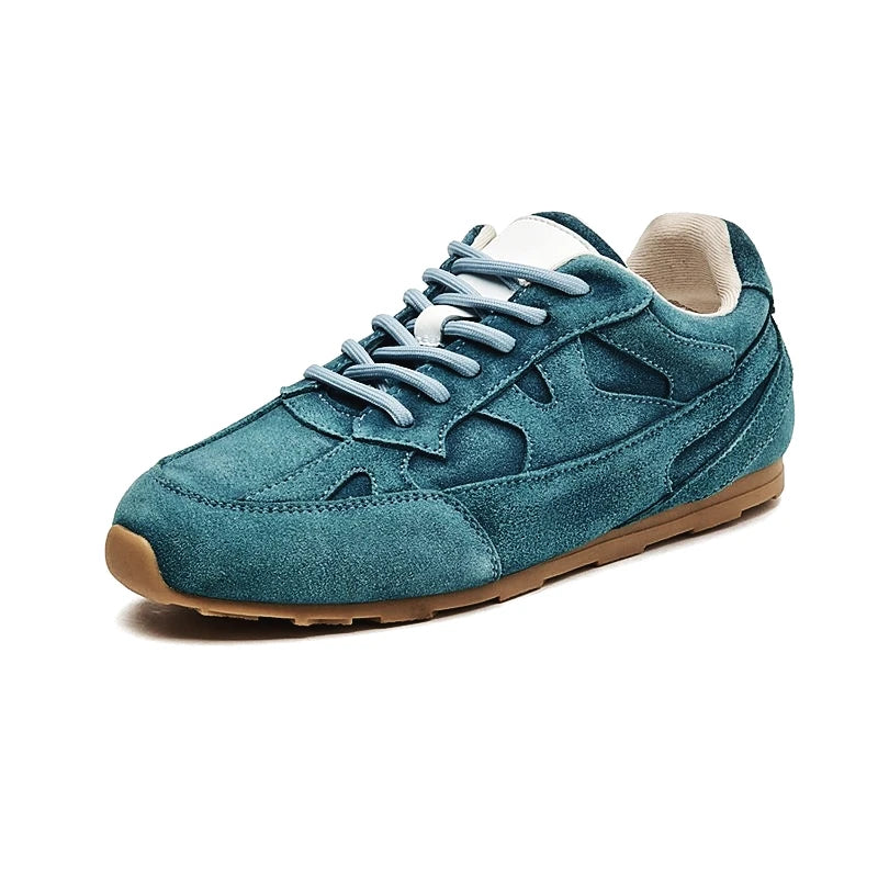 Teal suede women’s flat sneakers with lace-up front and cushioned collar