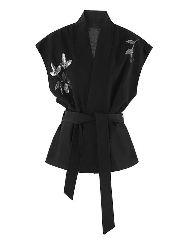 Black kimono-style belted vest with embroidered butterfly accents