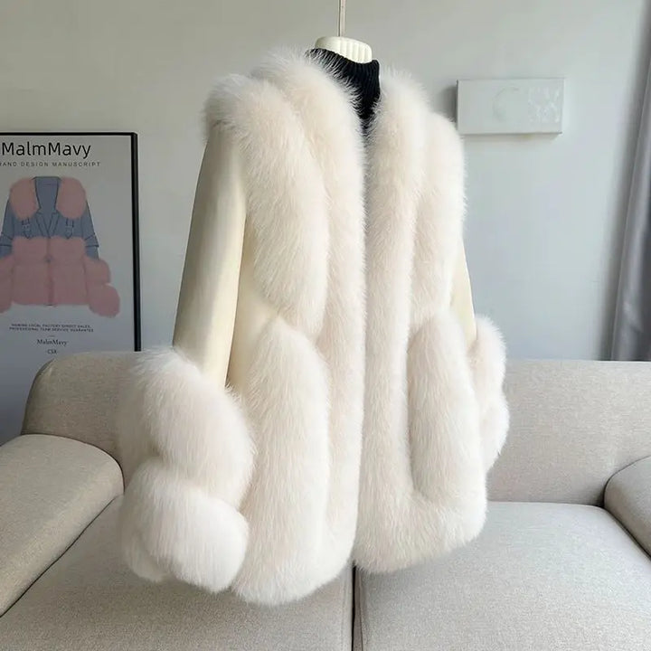 Women’s faux fur warm leather jacket in white, back view with thick fur trim and cuffs