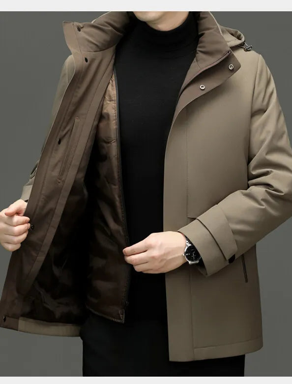 Person wearing a brown coat with a dark interior lining on a gray background