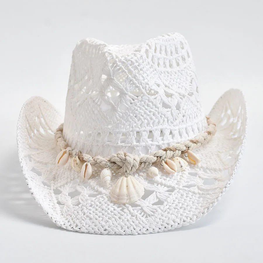 White woven hat with shell embellishments on a light gray background