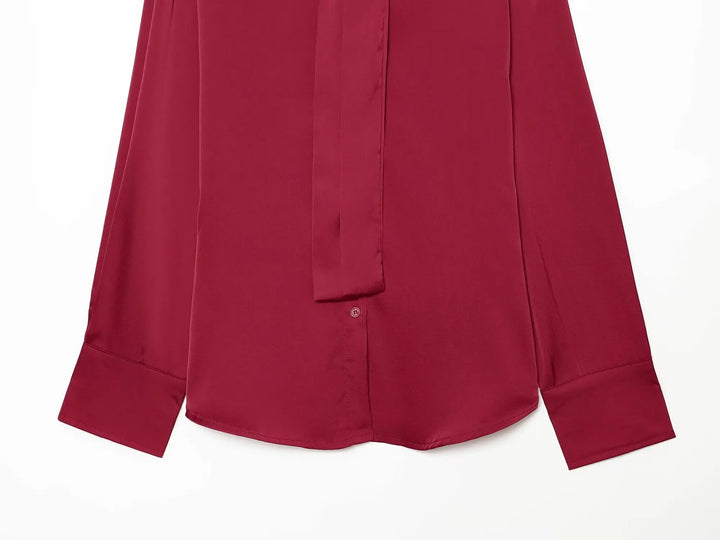 Red satin blouse with pleated front and long sleeves