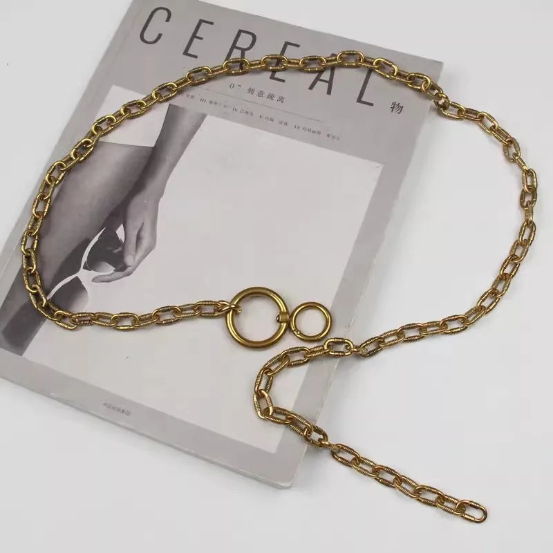 Gold chain waist belt with circular rings and extended chain drop, on product card