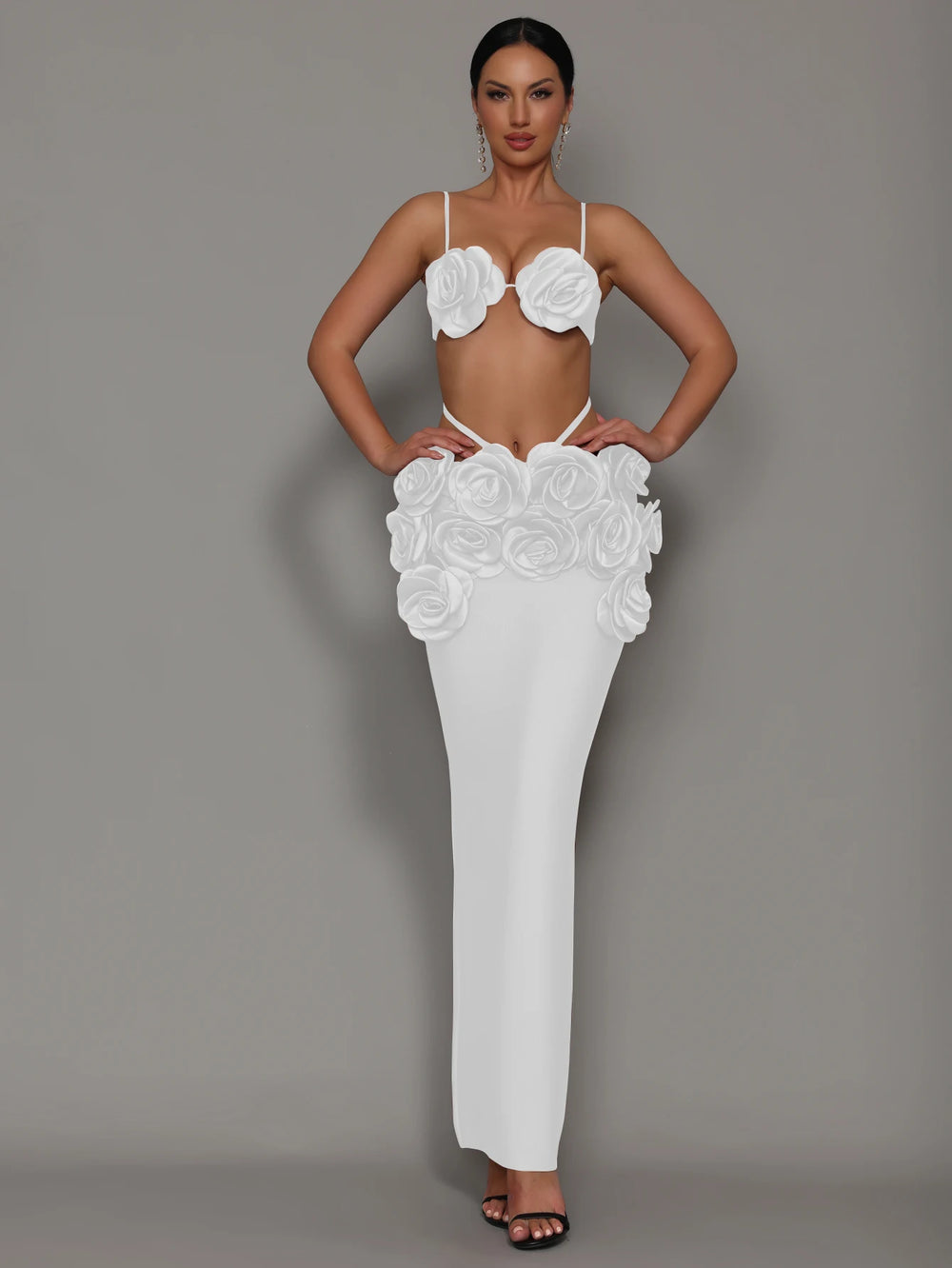 White two-piece maxi dress with rosette bra top and layered flower skirt, strapless