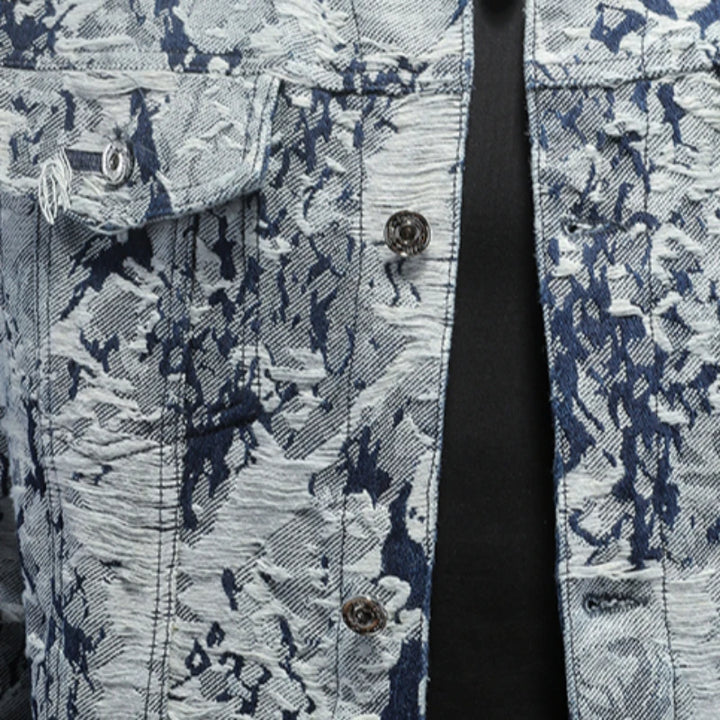 Buttoned front and chest pocket on abstract print jacket, dark blue stitching accents