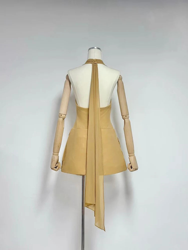 Beige A-line pleated mini dress with draped back sash