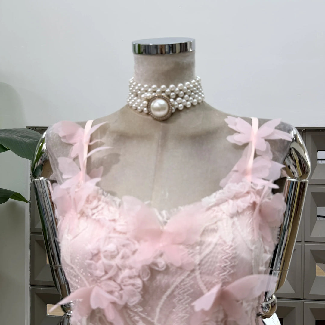 Pink lace corset mini dress with layered 3D flower appliques and pearl choker trim