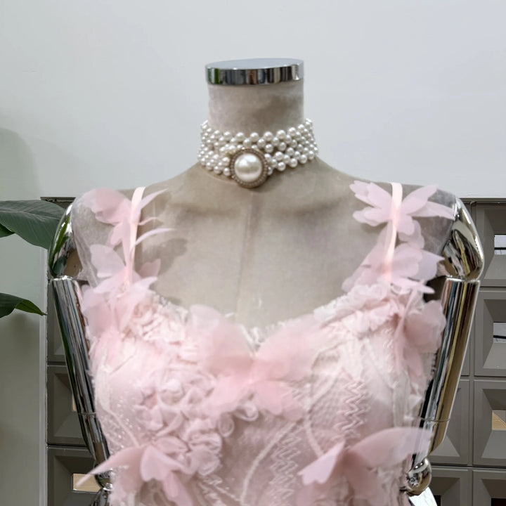 Pink lace corset mini dress with layered 3D flower appliques and pearl choker trim