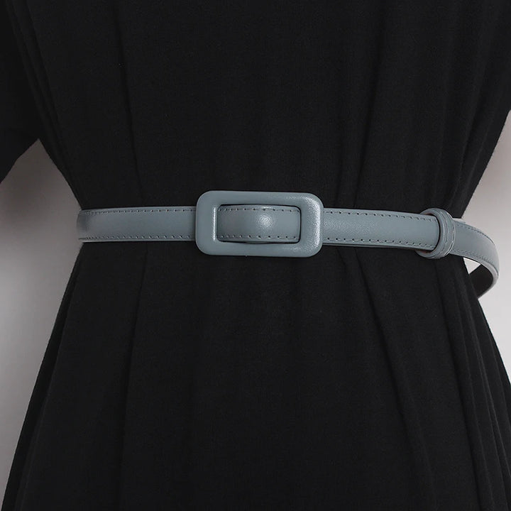 Women’s narrow genuine leather belt in black with rectangular silver-toned buckle