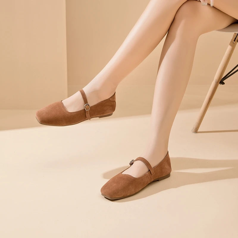 Tan-brown suede flat shoes with ankle strap and metal ring buckle