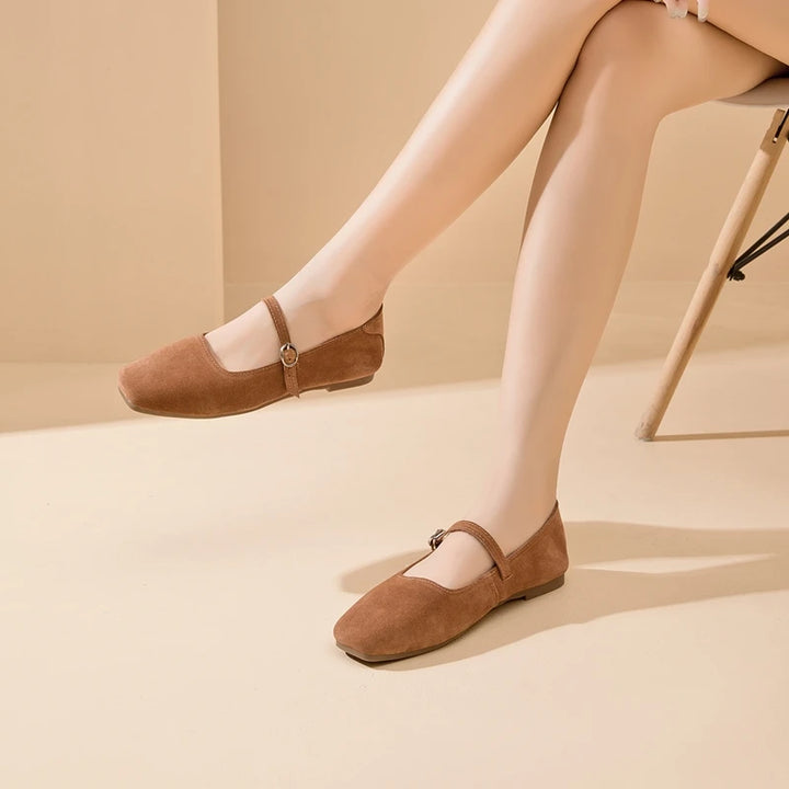 Tan-brown suede flat shoes with ankle strap and metal ring buckle