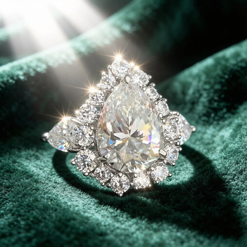 Pear-cut diamond ring with bright center sparkle and detailed round halo