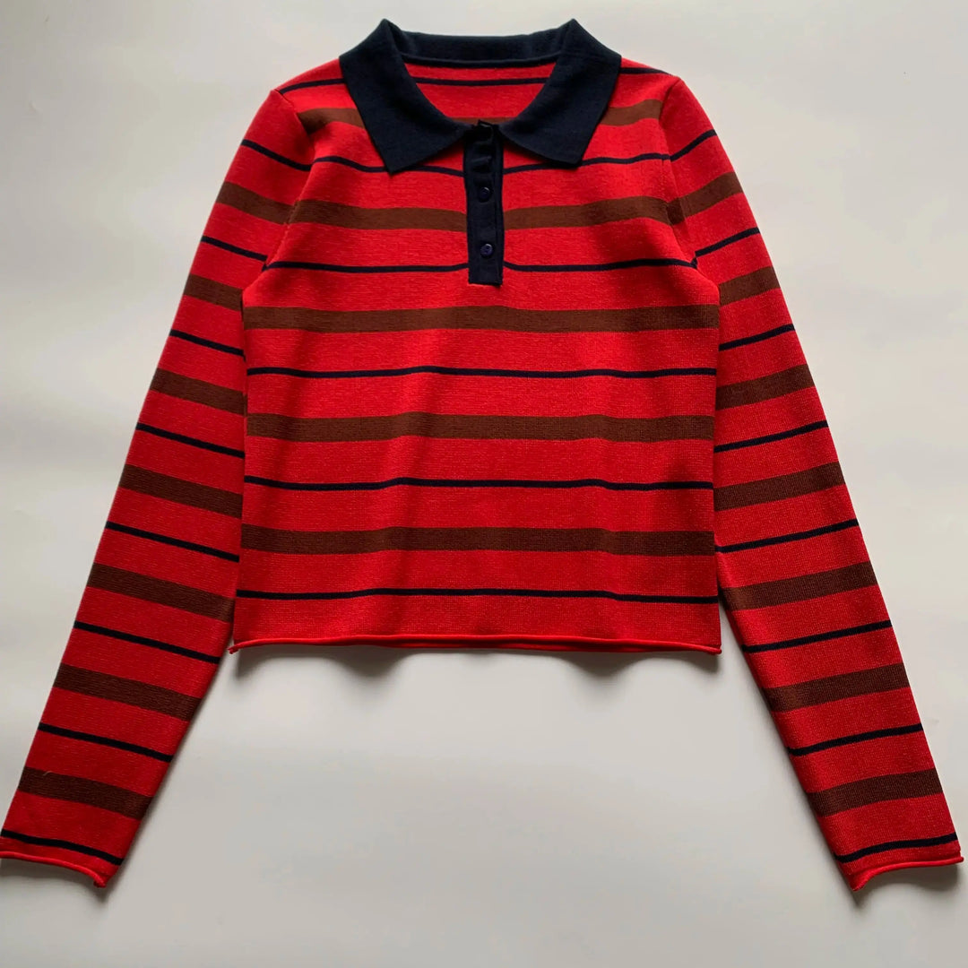 Orange-red striped polo sweater with navy collar, long sleeves, and front button placket
