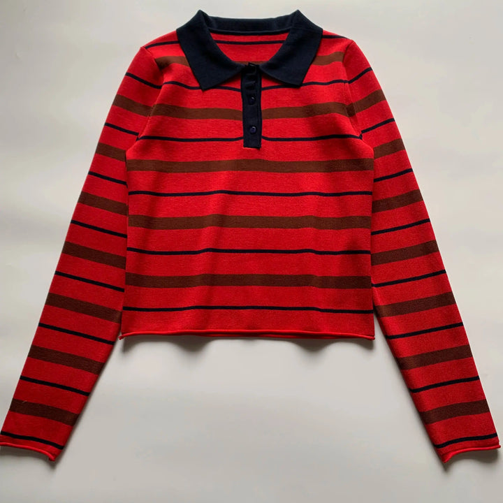 Orange-red striped polo sweater with navy collar, long sleeves, and front button placket
