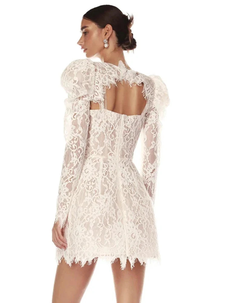 White lace dress with long sleeves on a white background