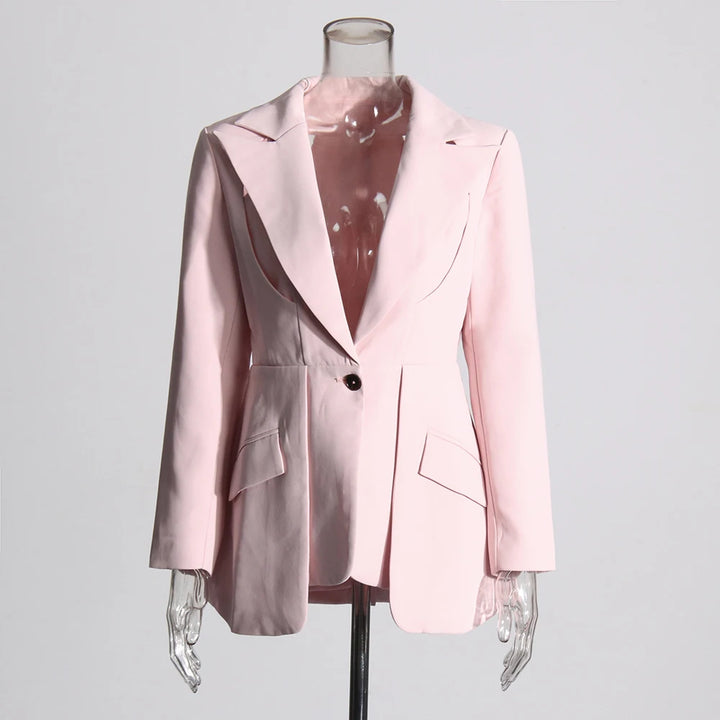 Two-tone patchwork blazer on mannequin with notched lapels and flap pockets