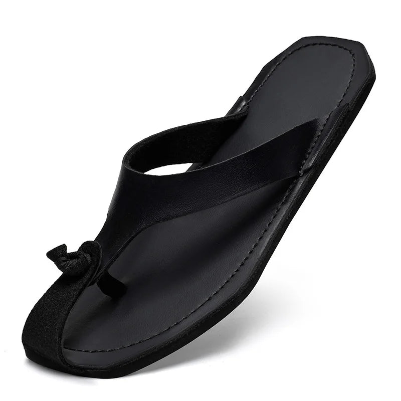 Black genuine leather men’s flip flops with fabric tie detail and stitched edges