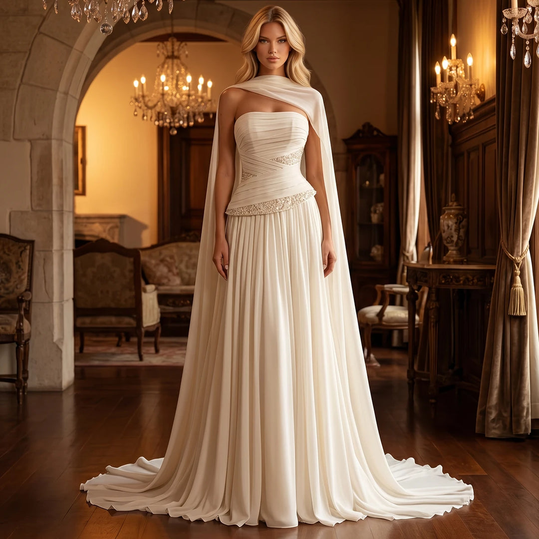 Ivory chiffon bridal gown with draped bodice, beaded waist, and long flowing train