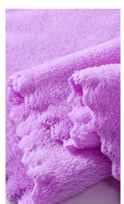 Purple plush bath towel with thick pile and neat pressed edge detail