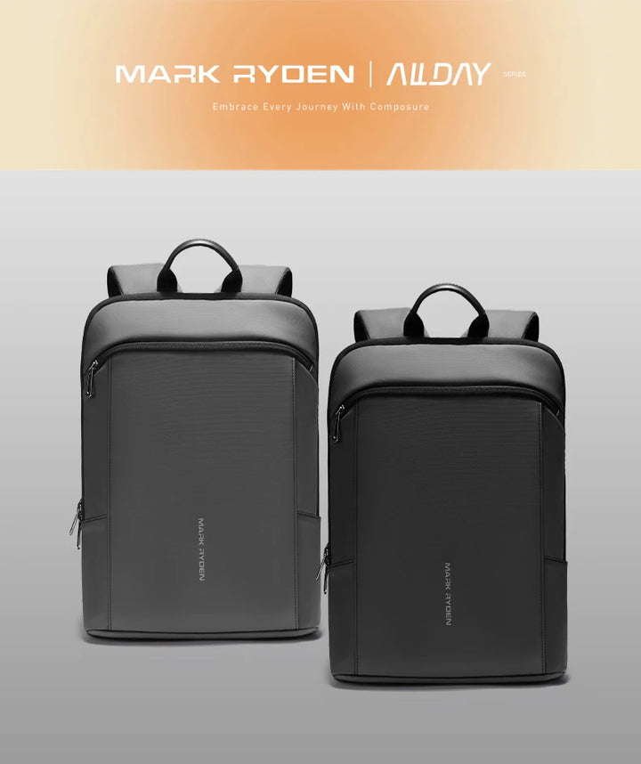 Two dark backpacks side by side with top handles and front zip compartment.