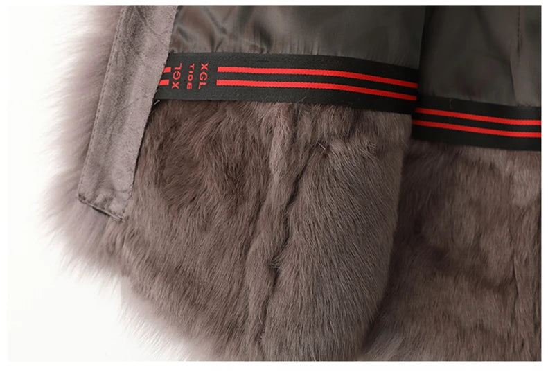 Grey trench coat with inner red-and-black striped trim and fur pocket opening