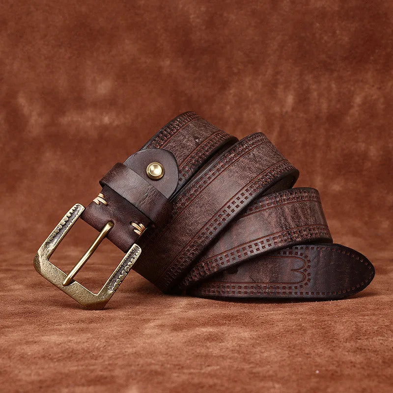 Brown leather belt with gold buckle on a brown background